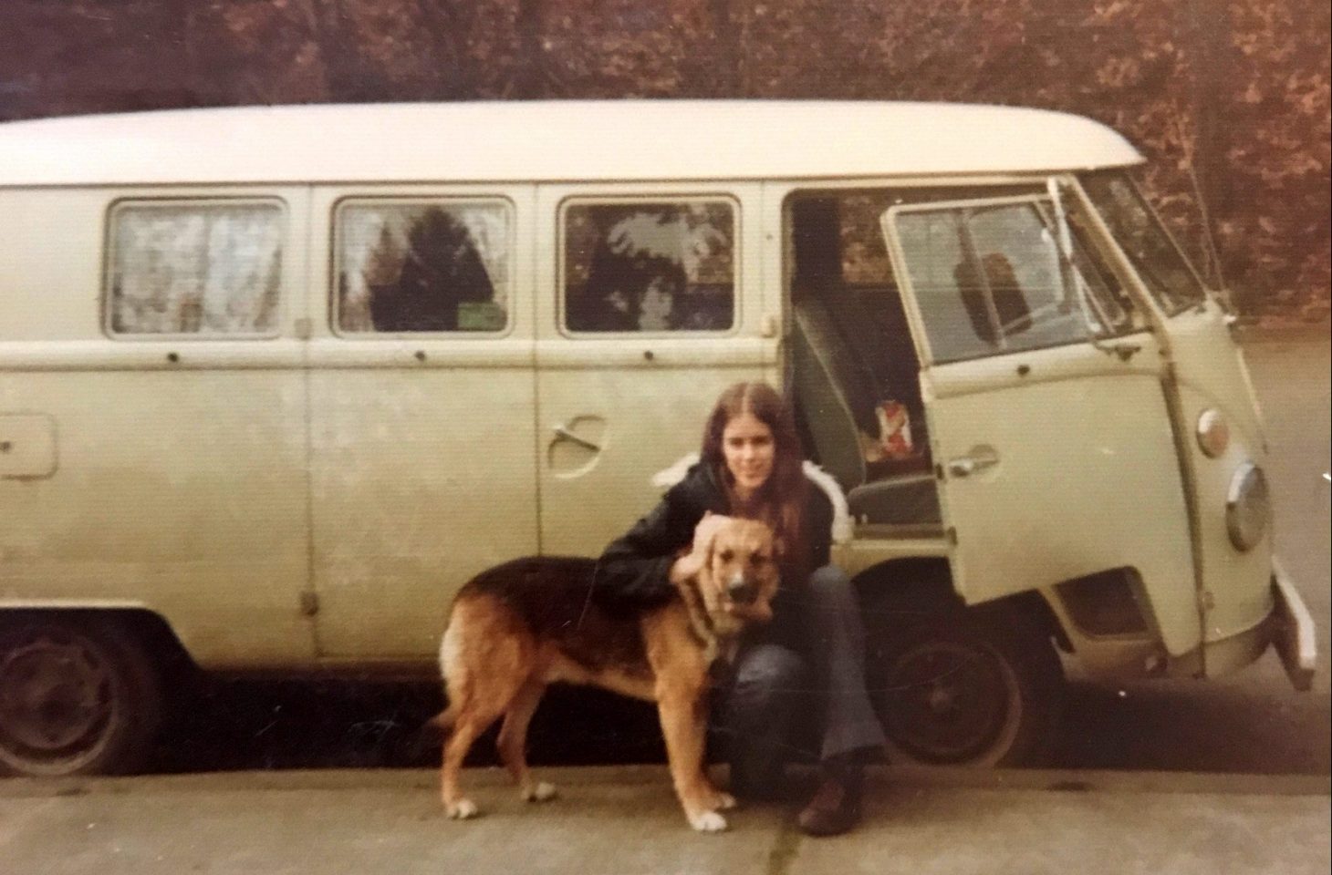 Young Monica With Her Dog In Front Of A Van