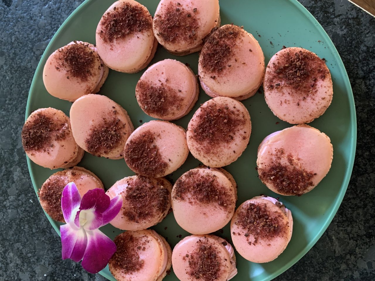 Pink And Maroon French Macarons Decorated With A Flower