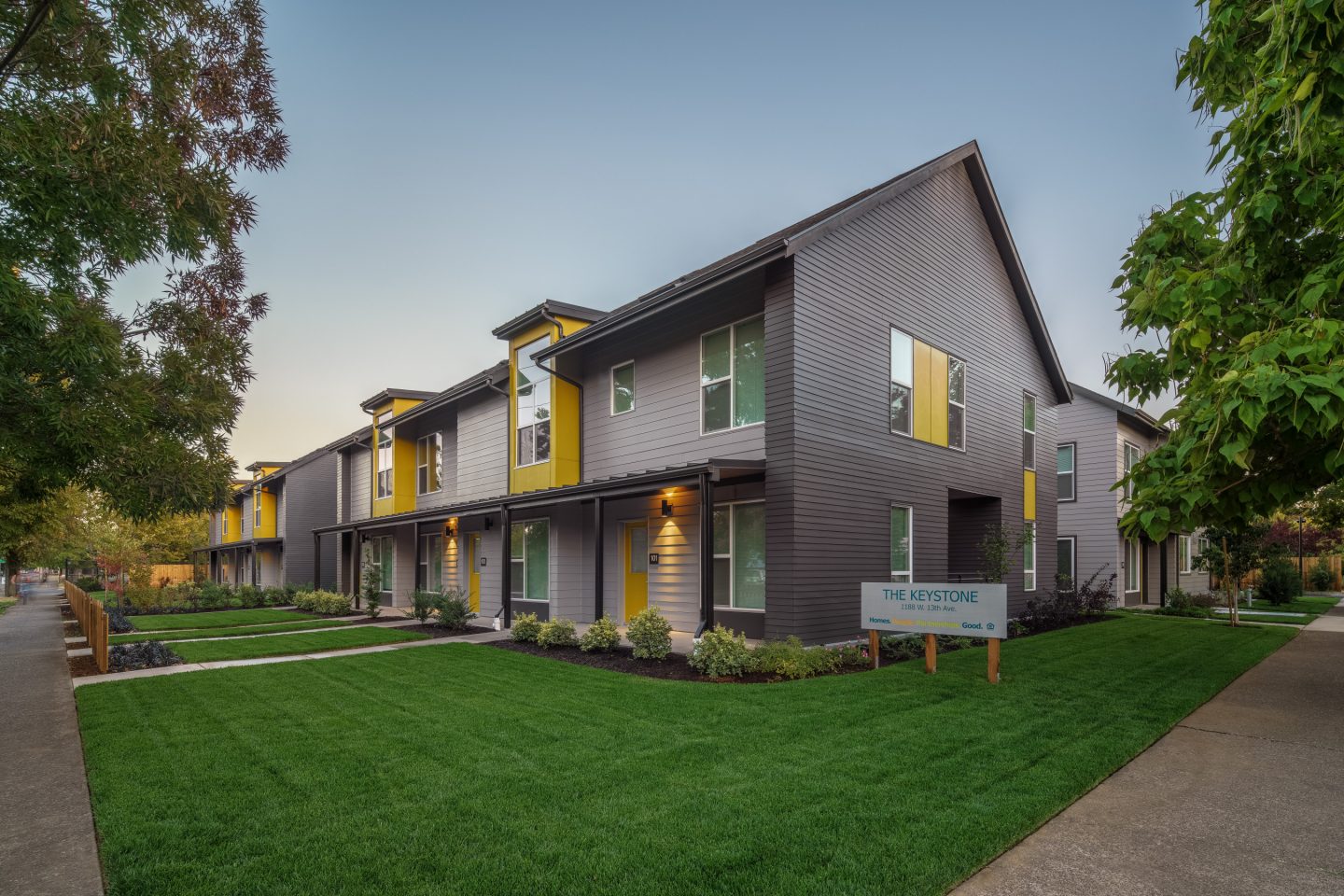 At The Corner Of Keystone Apartments, Mature Trees And Green Grass Preserve Regional Landscaping Of Eugene.