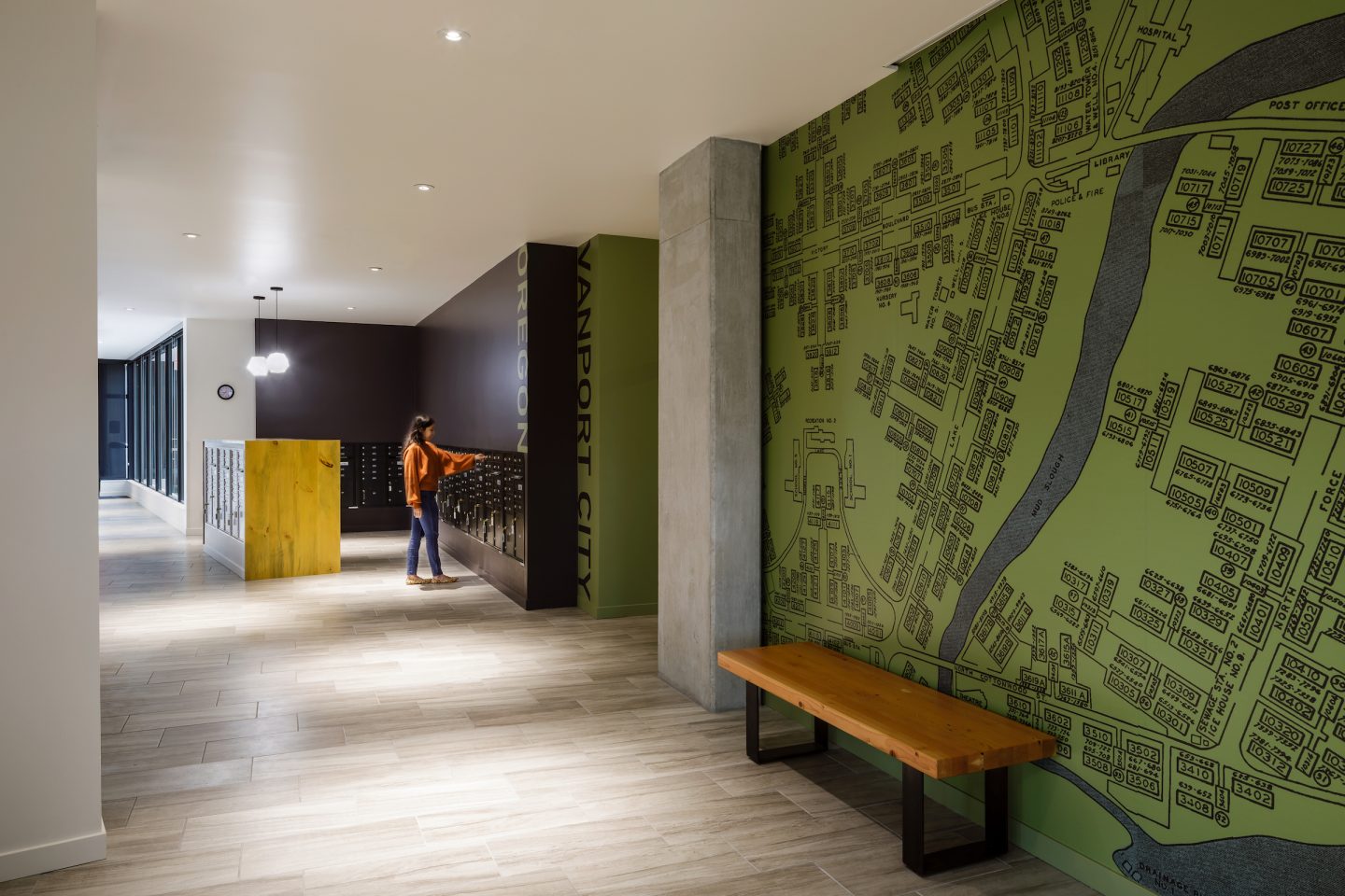 A Green Abstracted Map Of Historic Vanport Lines The Walls Of Renaissance Common's Lobby. 